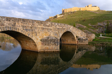 Fototapeta premium Medieval Castle of Burgo de Osma and the stone bridge, Soria, Castilla y León, Spain.