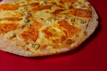 Tasty pizza four cheese - parmesan, dour blue, feta, mozzarella