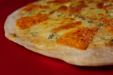 Tasty pizza four cheese - parmesan, dour blue, feta, mozzarella