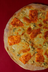 Tasty pizza four cheese - parmesan, dour blue, feta, mozzarella