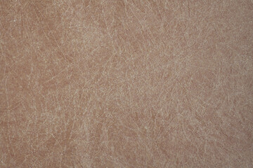 Crumpled brown paper texture background. Close-up of sheet of paper.