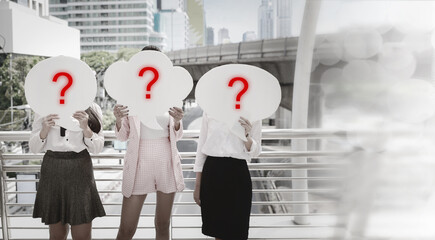 Group of unknown businesswoman standing and holding speech bubble with question mask and hiding...