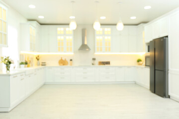 Blurred view of modern kitchen interior with stylish furniture