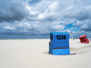Beach chair at the North Sea coast on a cloudy day