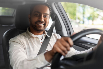 transport, vehicle and people concept - happy smiling indian man or driver driving car