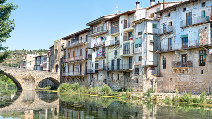 Landscape of a closed medieval stone segmental arch bridge over the river Matarraña in Teruel,...