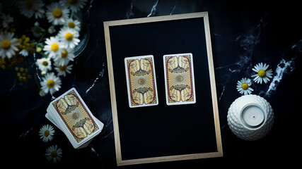 Fortune telling choosing concept. Two tarot cards on the table.