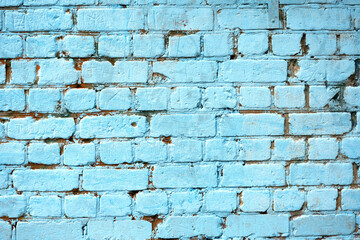 brick wall painted with blue paint