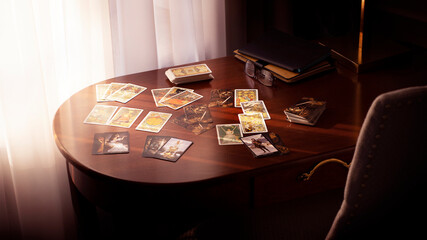 Blurred tarot cards on the table, esoteric concept, fortune telling predictions