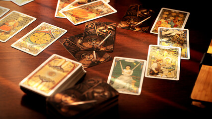Blurred tarot cards on the table, esoteric concept, fortune telling predictions - obrazy, fototapety, plakaty