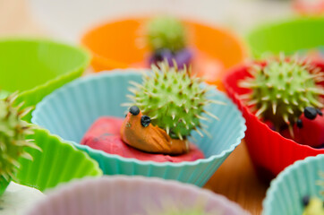 Chestnut fruit Hedgehog family. Toy animal made from play-dough and real Chestnut. Contest of Autumn harvest festival in kindergarten.