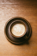Cup of coffee on wood background
