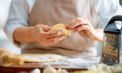 Hands preparing dough