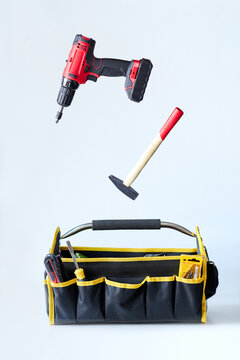 handyman tools in a large bag with white background
