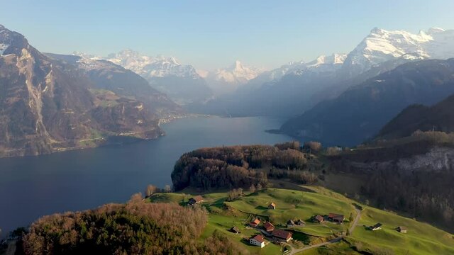 Dramatic aerial drone footage of the Seelisberg village by lake Lucerne in the alps in Switzerland. Shot with a rotation motion