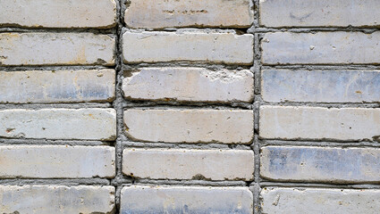 Old gray brick wall. Brick surface texture.