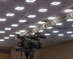 TV camera in the press conference room.