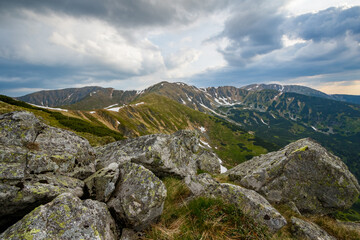 Mountain landscape photo of a mountain ridge with dark blue clouds. Slovakia nature Low Tatras.
