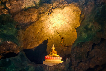 Buddha statue inside a cave in Thailand. Holy.