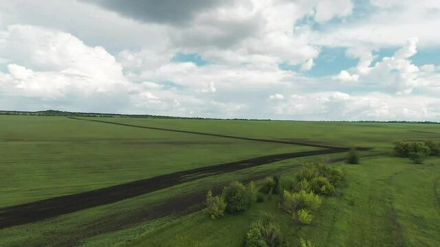 green field agriculture a aerial on green background. aerial top view agriculture farm business concept. motion aerial first person view bird flight. farmland view from a quadcopter crop