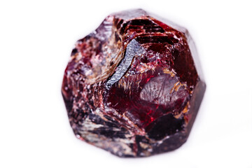 Macro of a mineral garnet stone on a white background