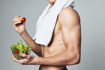 sport man eating healthy snack after workout cropped view
