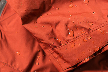 Detail photo of wateproof jacket with water droplets on it.