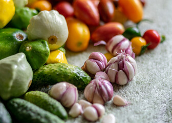 color photo with autumn vegetables on the table, different colors, shapes and types of vegetables prepared for home canning, autumn harvest time