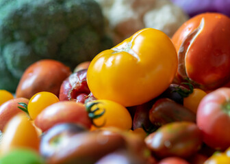color photo with autumn vegetables on the table, different colors, shapes and types of vegetables prepared for home canning, autumn harvest time