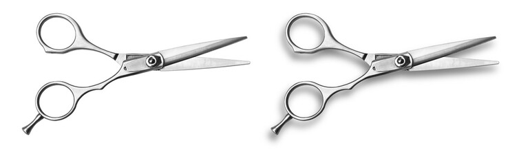 A pair of hairdressing, barber scissors on a white background. One pair of scissors is deep etched the other has a soft drop shadow