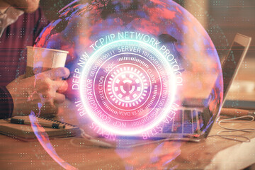 Double exposure of man's hands holding and using a digital device and tech theme hologram drawing. Technology concept.