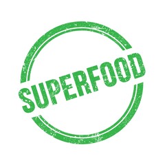 SUPERFOOD text written on green grungy round stamp.