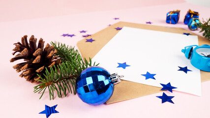 Christmas tree in envelope, minimal New Year s card. Spruce branch on pink background. Holidays, Congratulation concept, blue ball