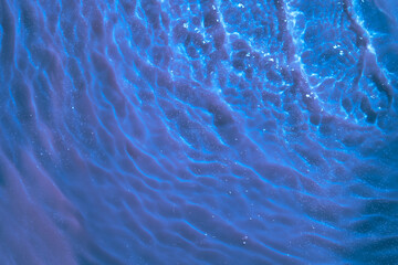 Water splashes top view with bubbles and waves on blue background