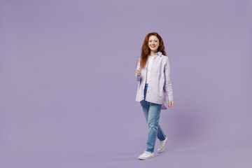 Full size body length charming smiling young redhead curly green-eyed woman 20s wears white T-shirt...