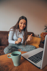 Fototapeta premium Woman holding credit card and shopping online.