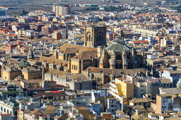 Aerial view of the city of Granada with its cathedral and historic buildings at the foot of the Alhambra.