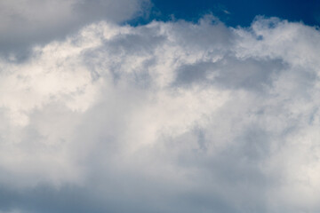 Fototapeta na wymiar Beautiful fluffy clouds in the summer sky.