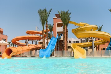 Obraz na płótnie Canvas Colorful aquapark constructions in swimming-pool