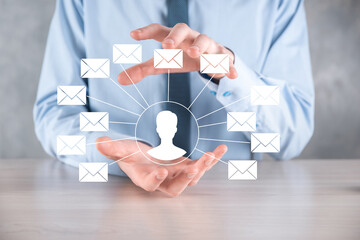 Male hand holding letter icon,email icons .Contact us by newsletter email and protect your personal information from spam mail. Customer service call center contact us.Email marketing and newsletter
