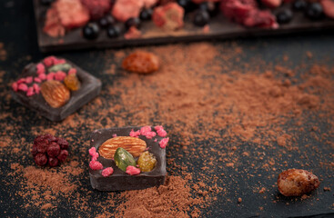 Homemade chocolate with dried berries: raspberries, strawberries and nuts