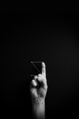 B&W image of hand demonstrating ASL sign language letter Z with empty copy space