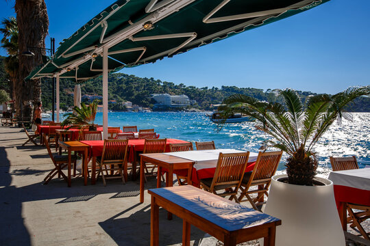 Fototapeta Lopud island in Croatia. Embankment and architecture of the island. View from the street cafe