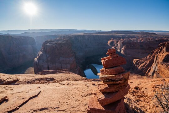 Stacking Stones in Horseshoe Bend at Page, Arizona - Powered by Adobe