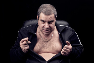 threatening look of the criminal of the Russian mafia, portrait of an adult dangerous gangster man,...