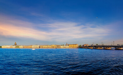 Fototapeta premium View of the river, panorama of the summer sunset St. Petersburg. Russia. Blagoveshchensky Bridge, Neva River, English Embankment, Sphinxes of the Academy of Arts, Vasilievsky Island.