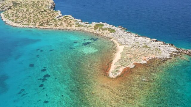 Aerial view of a beautiful island and crystal clear waters in Crete