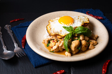 Thai food concept Khao pad krapao kai Authentic Thai Basil Chicken rice and crispy fried egg topping