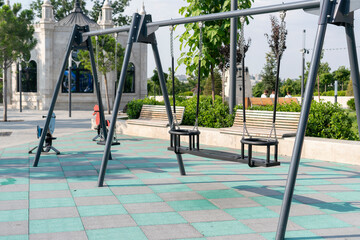 child swing on the empty playground, freedom happy childhood concept