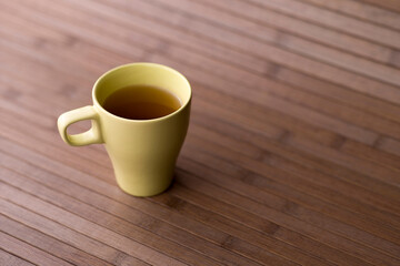 Cup of tea on bamboo background